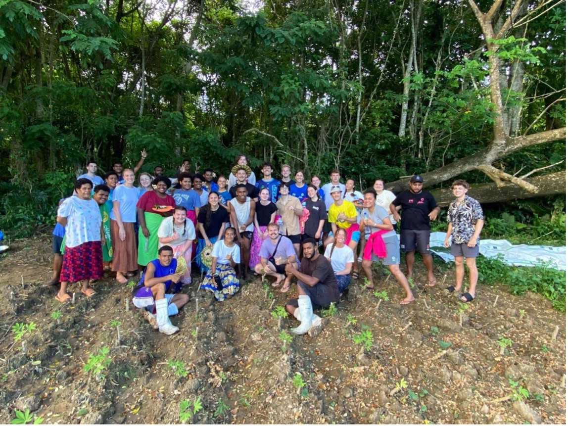 Fiji students with villiage people and drinking the traditional kava drink