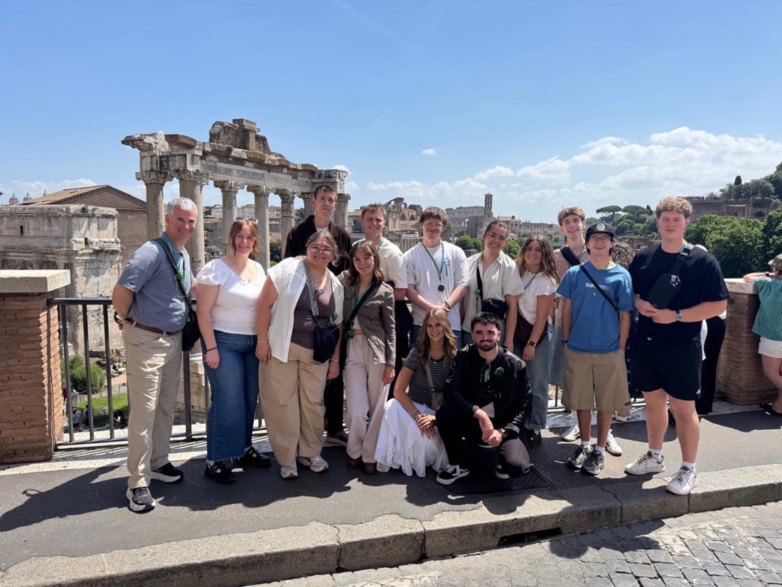 Rome students standing in front of ruins