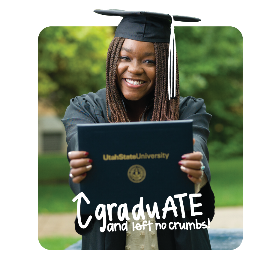 Student in cap and gown with diploma